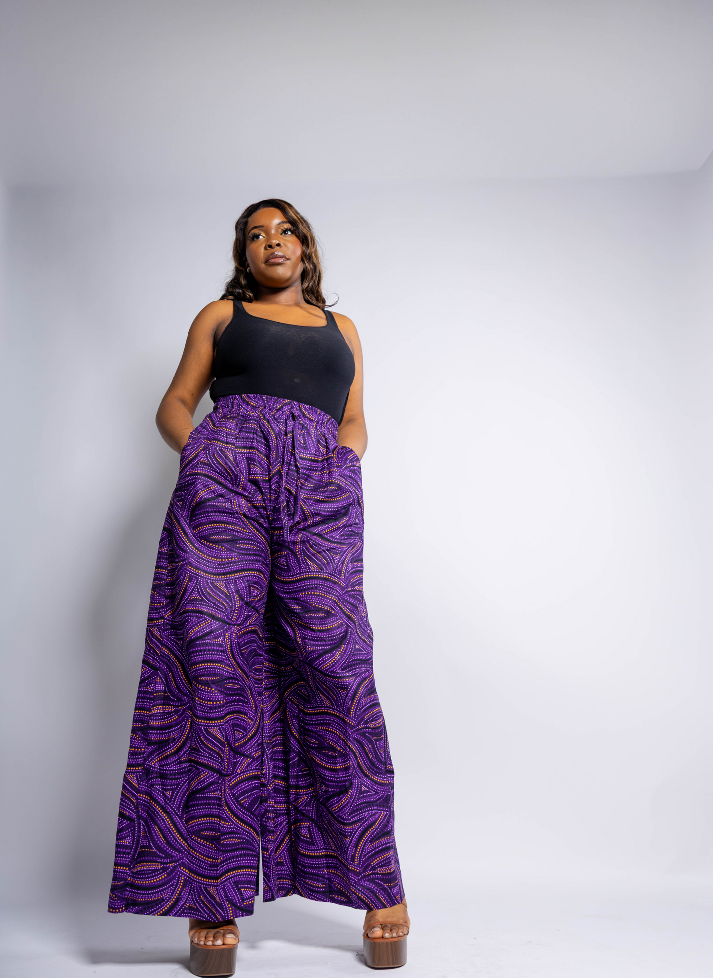Plus size purple African print palazzo trousers for women, UK sizing inclusive