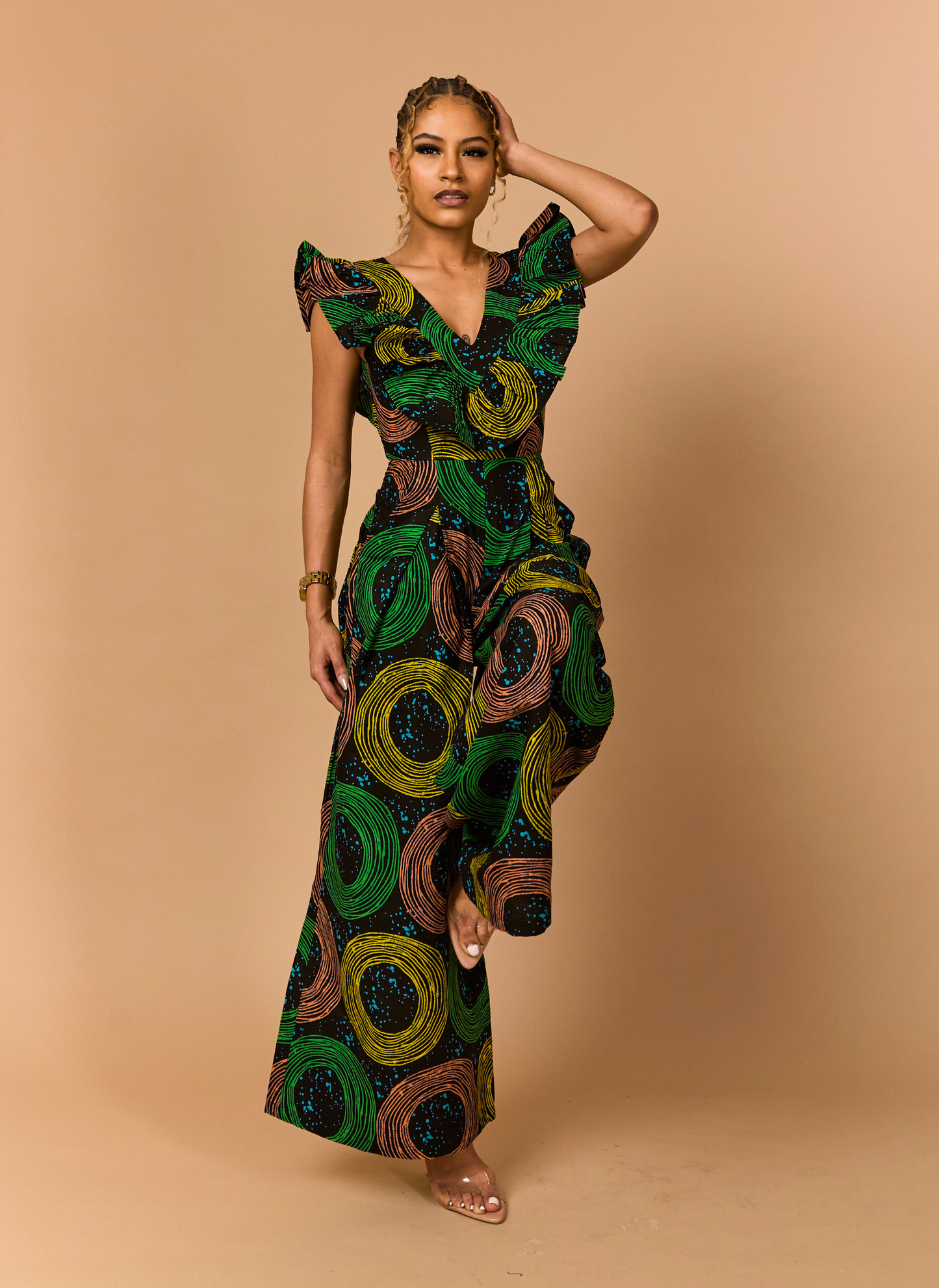 Full-body shot of the Zola African print jumpsuit, a perfect statement outfit for wedding guests.