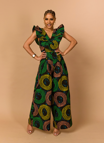 Front view of a green and gold African print jumpsuit with dramatic ruffle sleeves and wide-leg trousers